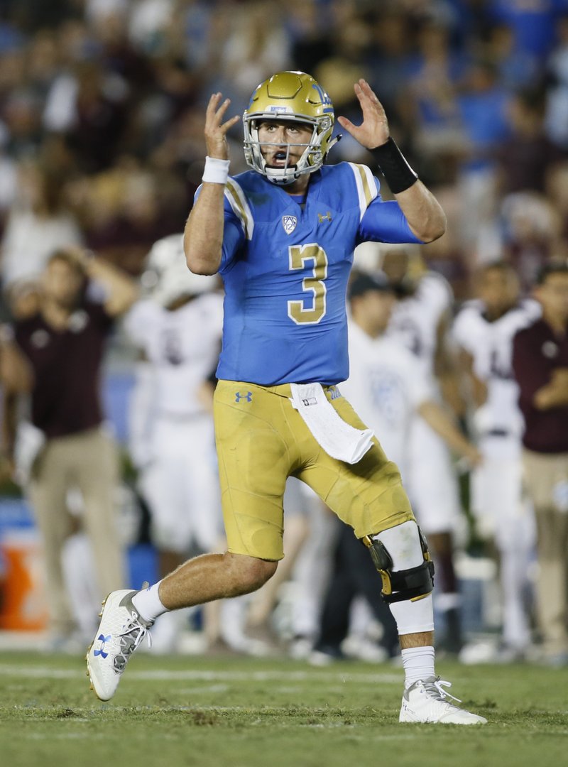 UCLA quarterback Josh Rosen gestures as if he was going to spike the ball before throwing for a touchdown with less than a minute to go in the second half of an NCAA college football game against Texas A&amp;M, Sunday, Sept. 3, 2017, in Pasadena, Calif. UCLA won 45-44. 