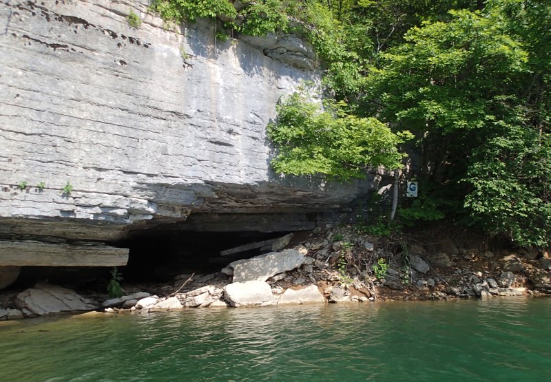 Eagle Hollow Cave at Hobbs State Park-Conservation Area is one of the landmarks of the Beaver Lake Aqua Trail. The letter “G” on shore at right corresponds to the same letter on the aqua-trail map.