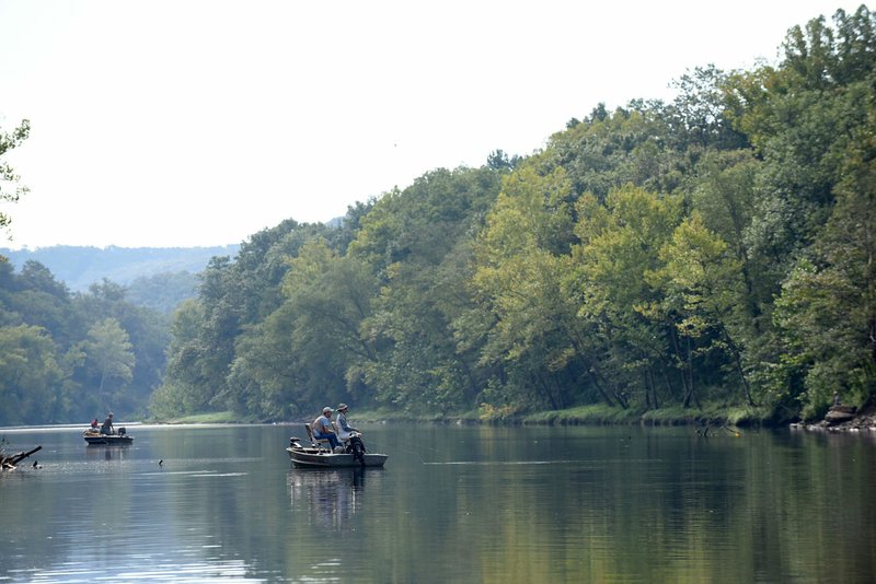 In this file photo anglers fish for trout on the Beaver tailwater using flies such as bead-head pheasant-tails, zebra midges and prince nymphs.