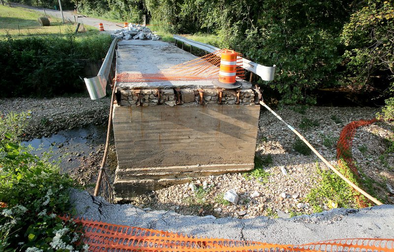 The bridge over Spring Creek on Pump Station Road in Springdale was irreparably damaged by the April and May floods. The road is closed and blocked from traffic.
