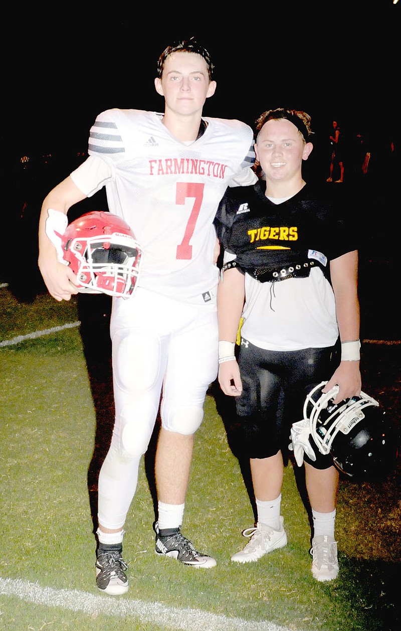 MARK HUMPHREY ENTERPRISE-LEADER Friendship and mutual respect supersedes rivalry on the football field once the final horn sounds. Farmington junior high quarterback Tate Sutton (left) and Prairie Grove wide receiver/defensive back Jackson Sorters have known each other since their fathers both coached on the Des Arc staff a few years ago. Farmington defeated the junior Tigers, 14-8, in a thrilling down-to-the-wire contest Thursday at Prairie Grove&#8217;s Tiger Den Stadium.