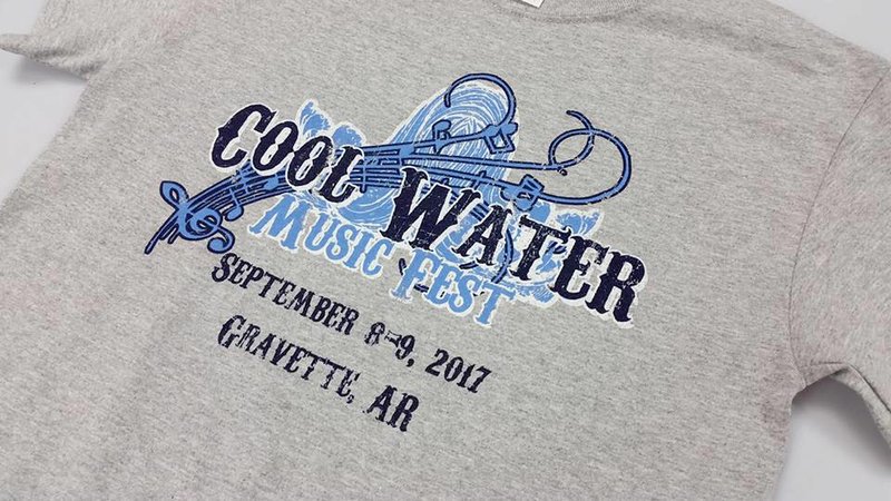 Photo by Jeff Thurstenson Cool Water Music Fest T-shirts are being sold and will be available for purchase at the two-day festival Friday and Saturday, Sept. 8 and 9, on Spavinaw Creek south of Gravette. The T-shirts were created by Jeff Thurstenson of A One Graphics in Siloam Springs. Festival tickets may be purchased online at coolwatermusicfest.com.