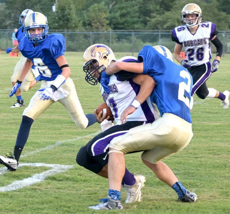 Photo by Mike Eckels Cayden Bingham (Decatur 2) tackled Luke Britt (Berryville 7) near the 30-yard line during the Decatur Bulldogs&#8217; football season opener against the Berryville Bobcats at Bulldog Stadium in Decatur on Sept. 1. Britt was heading toward the end zone when Bingham brought him down.