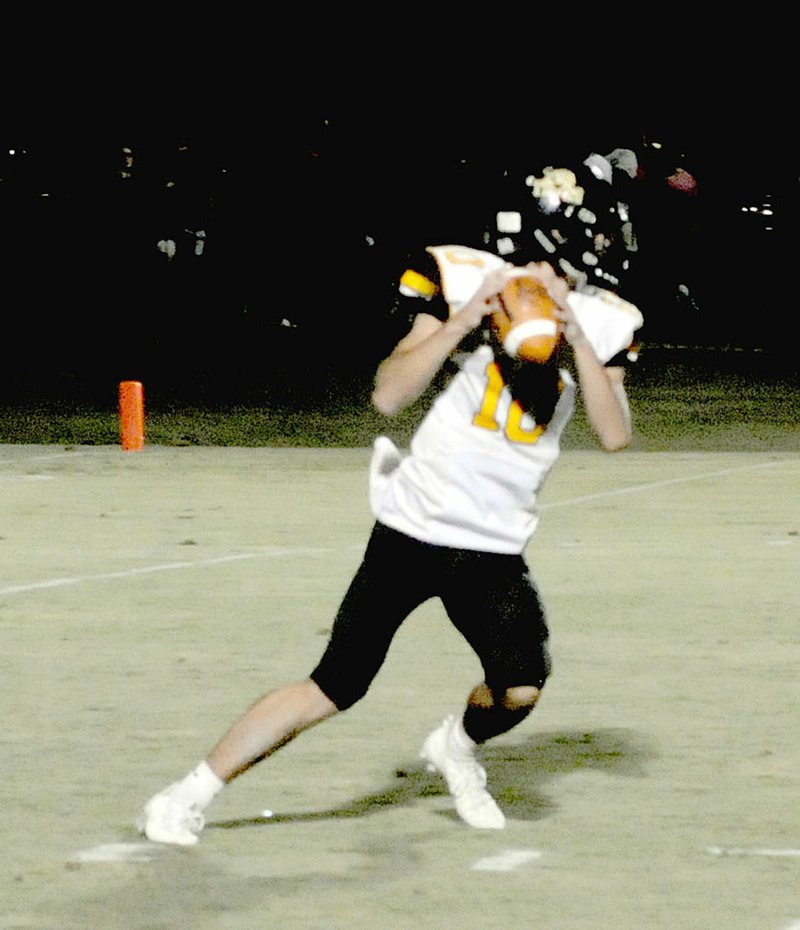 MARK HUMPHREY ENTERPRISE-LEADER Prairie Grove senior J.D. Elder drops back to pass against Farmington. Elder completed 8 of 13 passes for 93 yards, 2 touchdowns and a 2-point conversion as the Tigers prevailed against rival Farmington, 36-13, Tuesday, Aug. 29, in the annual gridiron &#8220;Battle of 62.&#8221;