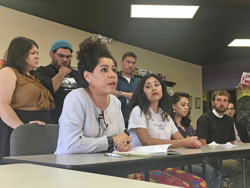 NWA Democrat-Gazette/DAN HOLTMEYER Mireya Reith (center left) speaks Tuesday against the Trump administration’s decision to end Obama-era protections for some immigrants brought into the country illegally as children at the Immigrant Resource Center in Springdale. She was joined by recipients of the program and their supporters and called the decision “a fulfillment of our worst nightmare.”