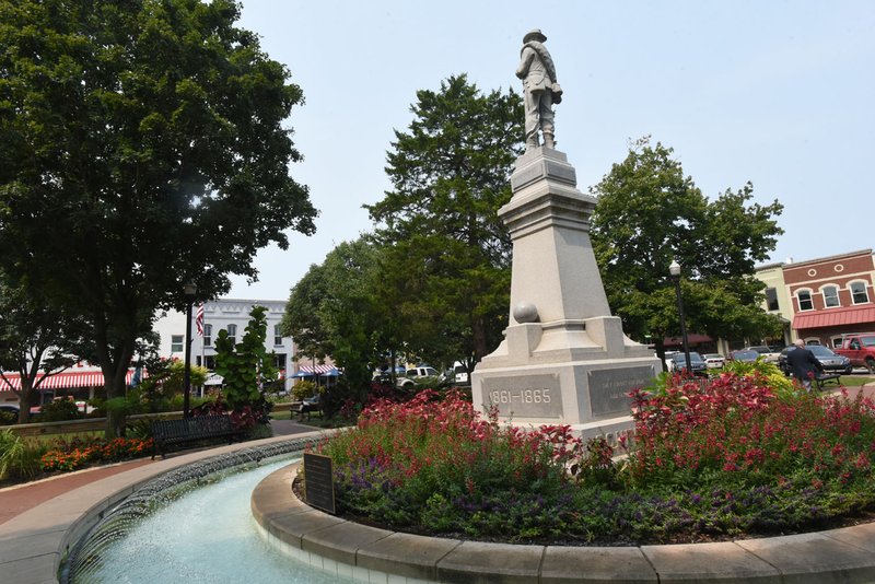 NWA Democrat-Gazette/FLIP PUTTHOFF One of the cannonball-shaped spheres on the Confederate monument is missing Tuesday on the Bentonville square. 