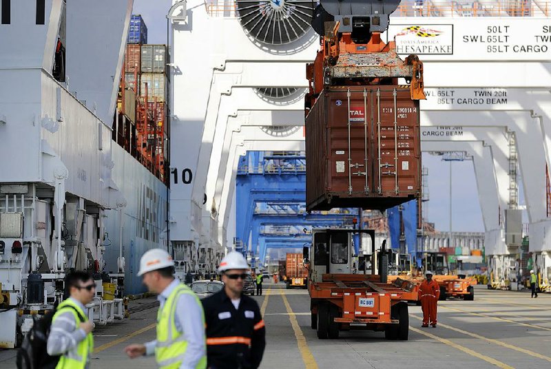 A container is unloaded at the Port of Baltimore in October. The U.S. trade gap rose to $43.7 billion in July, up from $43.5 billion in June, the Commerce Department reported Wednesday. 