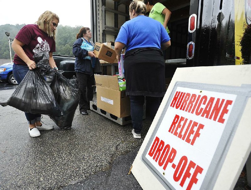 Volunteers load a tractor-trailer with donations for Hurricane Harvey victims earlier this week in Johnstown, Pa. The donations are to be delivered to Rosenberg, Texas, this weekend. 