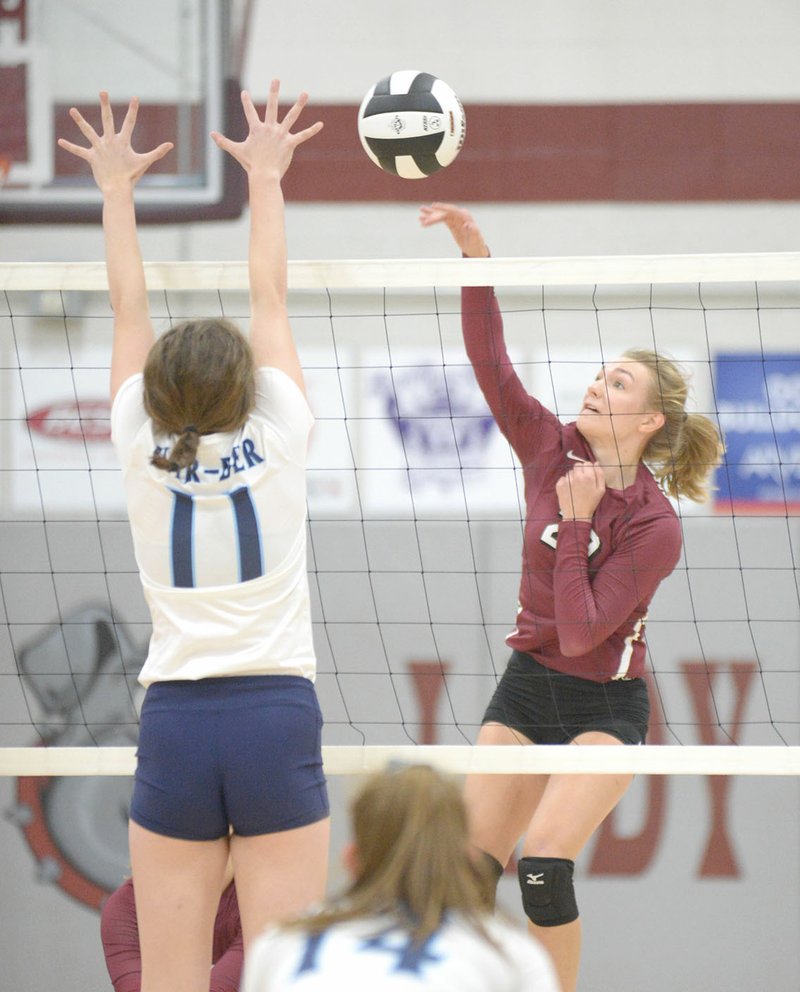 NWA Democrat-Gazette/ANDY SHUPE Springdale High’s Zoe Schmidt (right) spikes the ball past Springdale Har-Ber’s Mackenzie White on Tuesday at Springdale High.