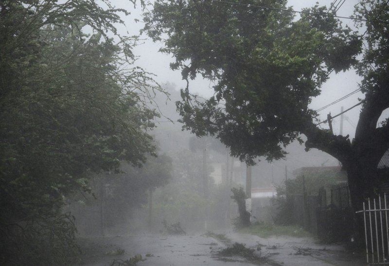High winds and rain sweep through the streets of the Matelnillo community during the passage of hurricane Irma, in Fajardo, Puerto Rico, Wednesday, Sept. 6, 2017. The U.S. territory was first to declare a state of emergency las Monday, as the National Hurricane Center forecast that the storm would strike the Island Wednesday. (AP Photo/Carlos Giusti)
