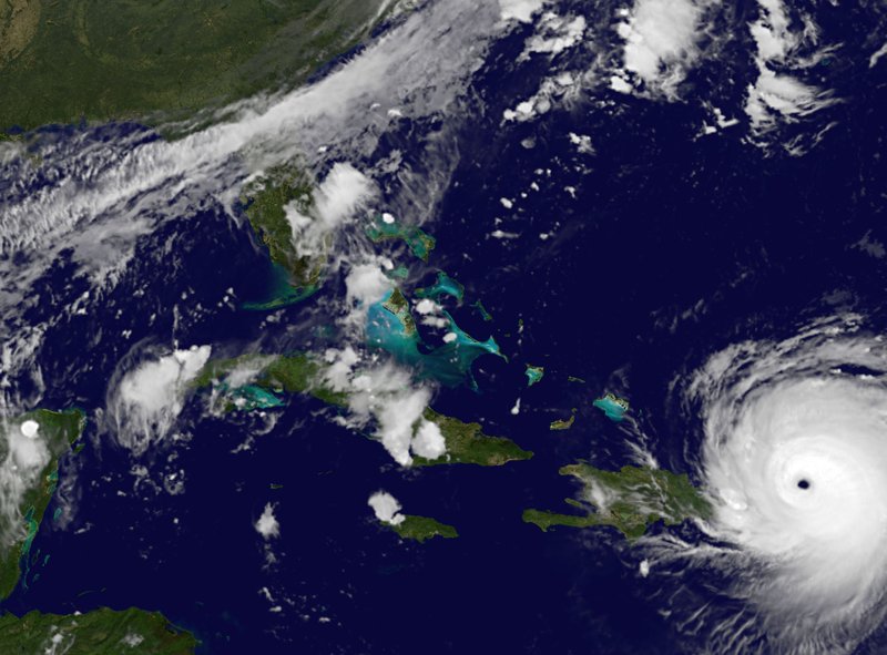 In this satellite image released by NASA/NOAA GOES Project, Hurricane Irma reaches Puerto Rico on Wednesday, Sept. 6, 2017. A decade-long lucky streak of decent weather that helped rescue one of Florida's biggest home insurers from collapse could come to a wet, violent end if predictions about Hurricane Irma prove true. (NASA/NOAA GOES Project via AP)
