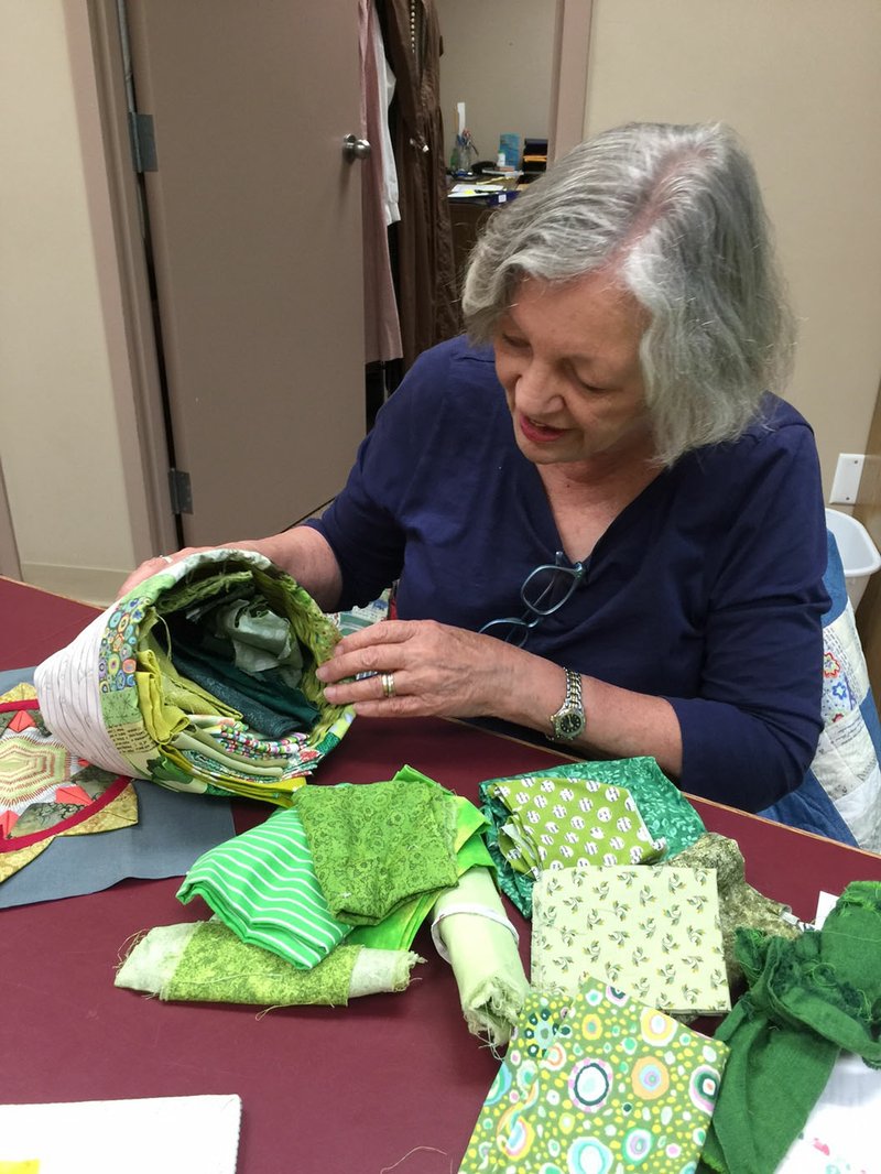 NWA Democrat-Gazette/BECCA MARTIN-BROWN Quilter Jan Murray Brown shows off one of her scrap baskets, a resource for finding the perfect piece of fabric for a design.