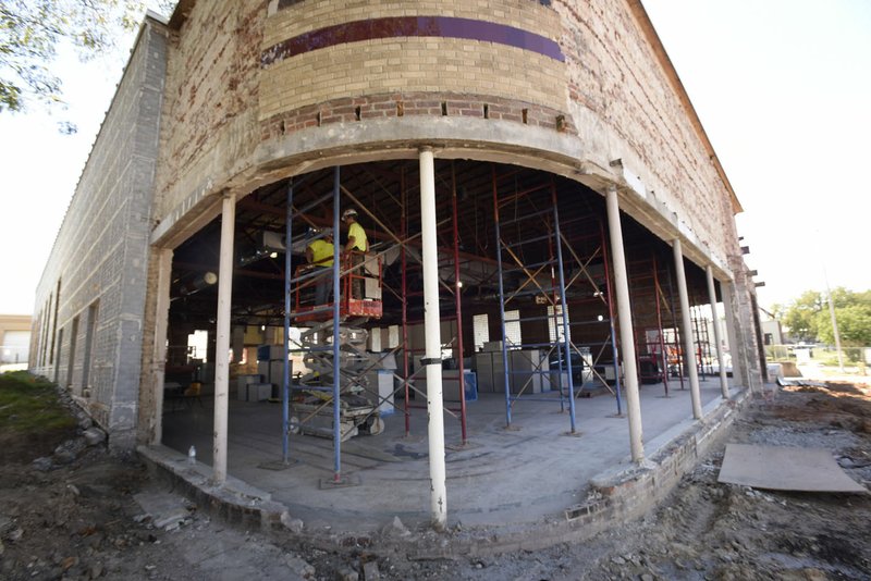 Work progresses Thursday on remodeling the Hailey Ford building in downtown Rogers for an expansion of the Rogers Historical Museum. For years, the building housed the Rogers Morning News.