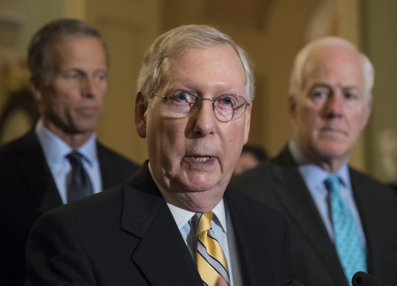 Senate Majority Leader Mitch McConnell, R-Ky., flanked by Sen. John Thune, R-S.D., left, and Majority Whip John Cornyn, R-Texas, speaks at the Capitol after President Donald Trump overruled congressional Republicans and his own treasury secretary and cut a deal with Democrats to fund the government and raise the federal borrowing limit for three months, all part of an agreement to speed money to Harvey relief, in Washington, Wednesday, Sept. 6, 2017. (AP Photo/J. Scott Applewhite)