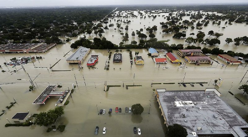 Water from Addicks Reservoir flows into neighborhoods as floodwaters from Tropical Storm Harvey rise in Houston late last month. 
