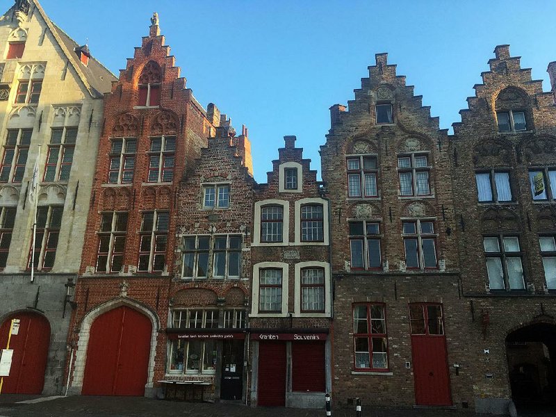 Rows of gilded  houses, some of which date to the 16th century, line streets in Bruges, Belgium. The city escaped  damage during the world wars and looks much as it did centuries ago.