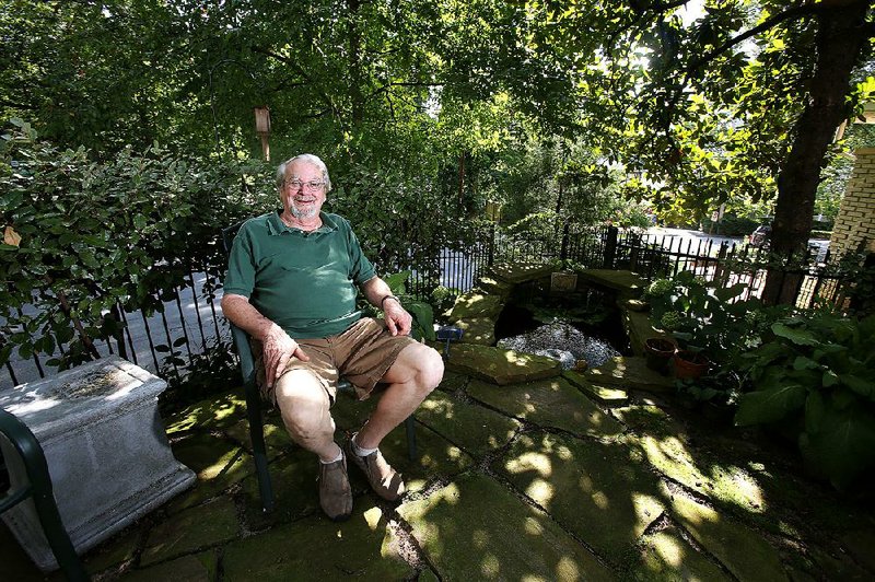 Jim Newberry in his outdoor patio area at his home on Hillcrest Avenue. 