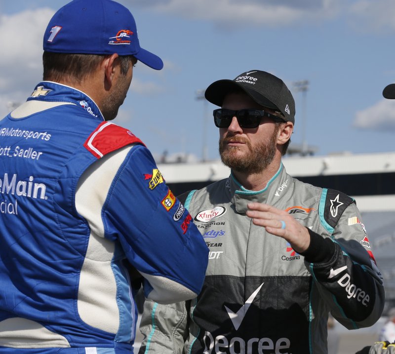 Dale Earnhardt Jr., right, talks with Elliott Sadler prior to qualifying for the Xfinity Series auto race at the Richmond International Raceway in Richmond, Va., Friday, Sept. 8, 2017. 
