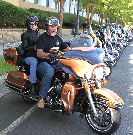 The Sentinel-Record/Richard Rasmussen OPEN RALLY: Rhonda Adams, of Pickwick, Tenn., left, and Richard Snow, of Olive Brand, Miss., take off on a ride from the Hot Springs Convention Center on Friday during the Hot Springs Rally.