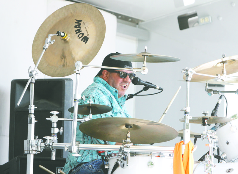 Drums: Paul Baumgardner of the band Aces Wild performs during the SouthArk Outdoor Expo.