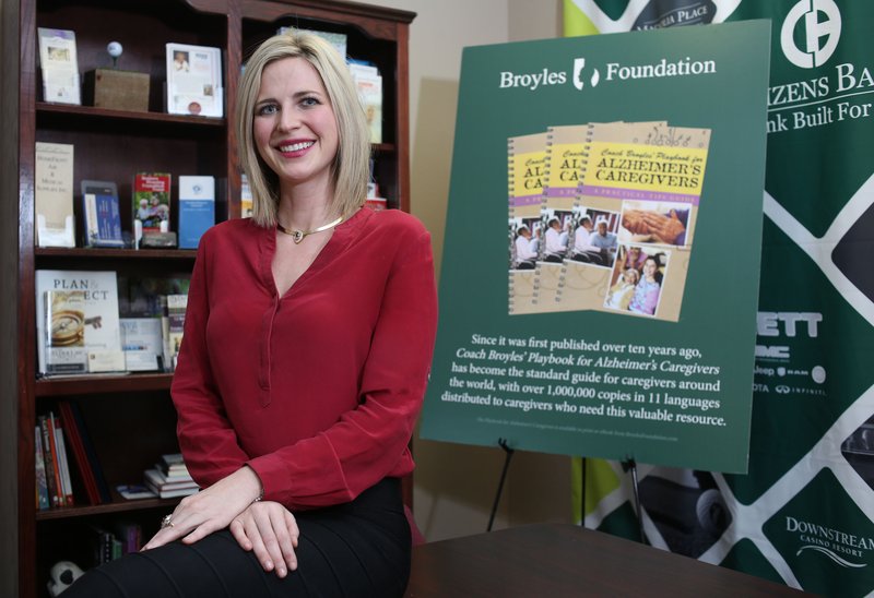 Molly Arnold, granddaughter of Frank Broyles, pauses at the Broyles Foundation office in Fayetteville. The organization’s mission is to support those giving care to Alzheimer’s patients.