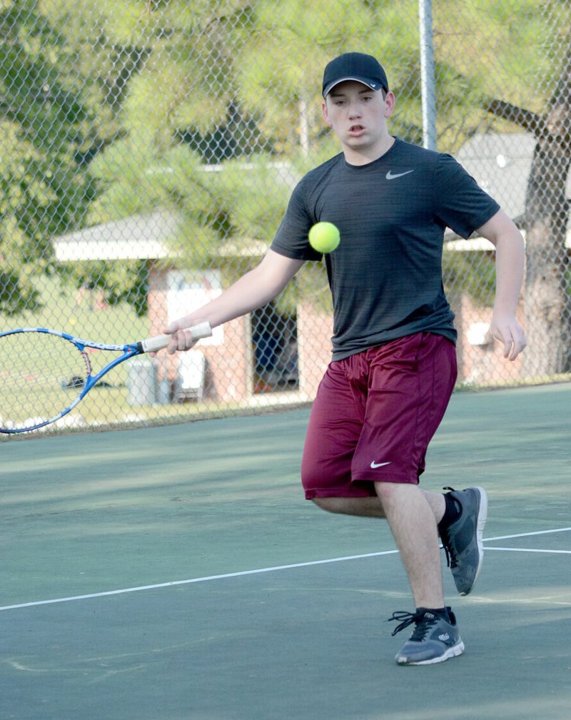 Janelle Jessen/Siloam Sunday Siloam Springs sophomore Trey Hardcastle looks to hit the ball during a match Thursday at the John Brown University tennis courts.