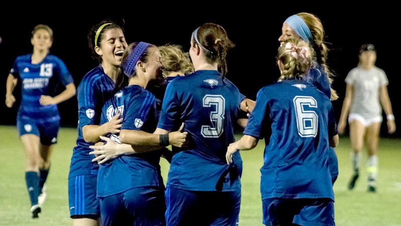 Photo courtesy of JBU Sports Information John Brown University women&#8217;s soccer players celebrate Thursday evening after scoring a goal against Our Lady of the Lake (Texas), in a 4-1 JBU win at Alumni Field.