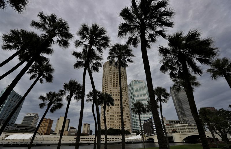 Storm clouds associated with the outer bands of Hurricane Irma shroud the downtown skyline Saturday, Sept. 9, 2017, in Tampa, Fla. Several parts of the Tampa Bay area are under a mandatory evacuation order for the approaching storm. (AP Photo/Chris O'Meara)