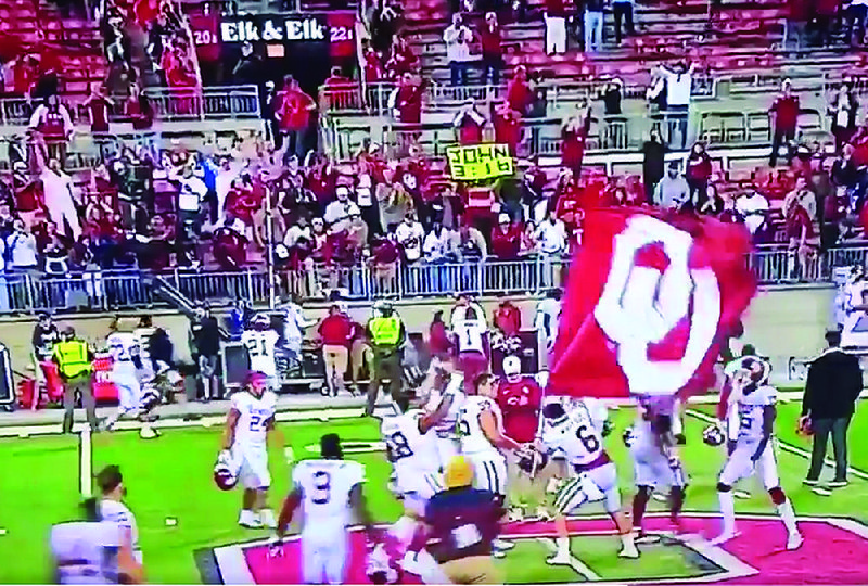 Oklahoma quarterback Baker Mayfield (6) planted an OU flag in the middle of Ohio State’s logo after the Sooners defeated the Buckeyes, 31-16, on Saturday night in Columbus, Ohio.