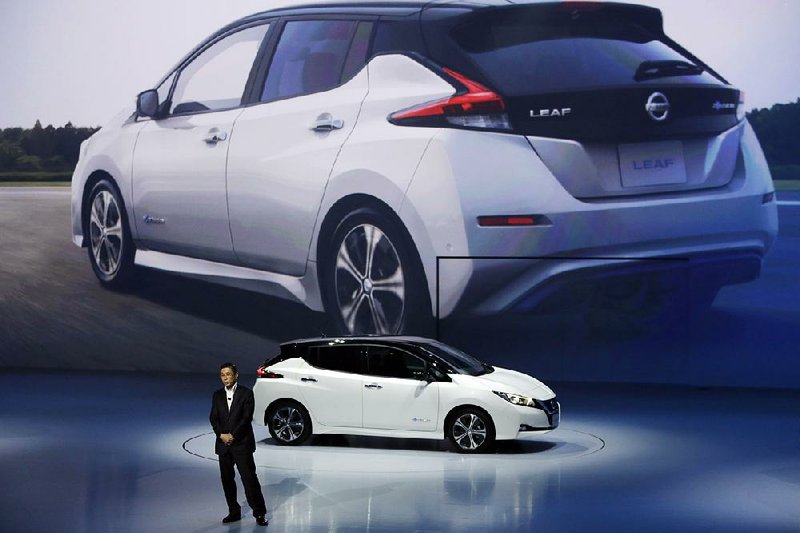 Nissan President and Chief Executive Officer Hiroto Saikawa unveils the company’s new Leaf electric vehicle during the world premiere in Chiba, near Tokyo, last week.