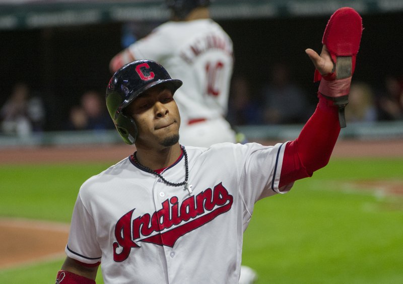 Cleveland Indians' Francisco Lindor is greeted at the dugout after scoring on a fielders choice by Jose Ramirez during the first inning against the Baltimore Orioles of a baseball game in Cleveland, Sunday, Sept. 10, 2017. 