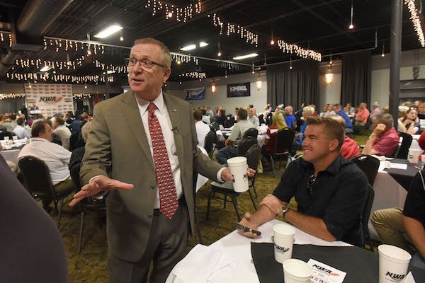 Jeff Long, University of Arkansas, Fayetteville, athletic director, chats Wednesday Sept. 6 2017 after his talk to the NWA Touchdown Club.