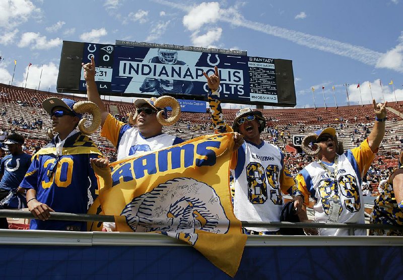 Fans cheer before Sunday’s game between the Rams and Colts in Los Angeles. Despite a paid attendance of 60,128, the crowd looked less than half-full, according to Pro Football Talk.