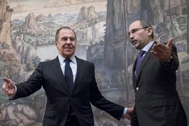 In this Jan. 24, 2017 file photo, Russian Foreign Minister Sergey Lavrov, left, welcomes Jordanian Foreign Minister Ayman Al Safadi during their meeting in Moscow, Russia. 