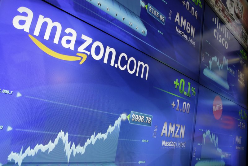 FILE - In this Tuesday, May 30, 2017, file photo, the Amazon logo is displayed at the Nasdaq MarketSite, in New York's Times Square. Amazon announced Thursday, Sept. 7, that it has opened the search for a second headquarters, promising to spend more than $5 billion on the opening. (AP Photo/Richard Drew, File)

