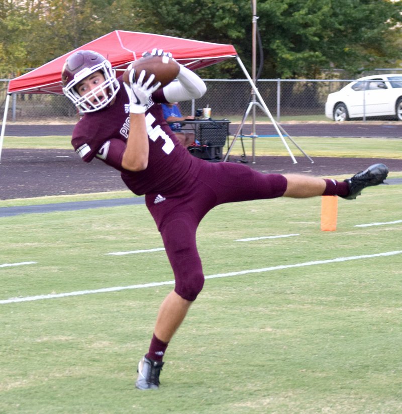 Photo by Mike Eckels Gentry&#8217;s Brandon Atwood catches a pass by quarterback Jon Faulkenberry in the end zone for his first touchdown during the Gentry-Decatur football game at Pioneer Stadium in Gentry Sept. 8.