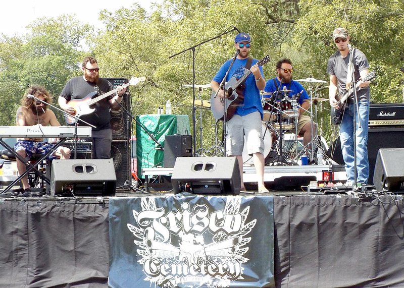 Photo by Randy Moll Frisco Cemetery took to the stage Saturday afternoon to kick off the Saturday festivities at the Cool Water Music Festival near Gravette.
