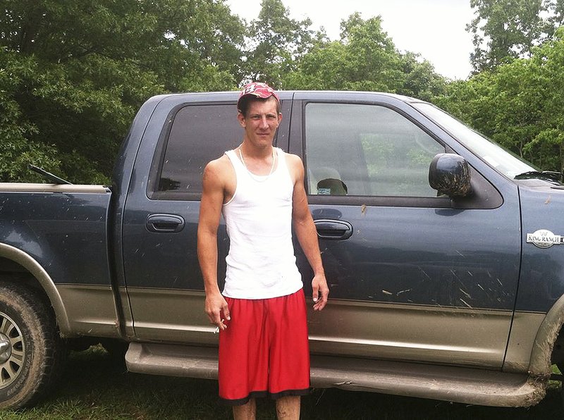 Wade Woods is shown standing in front of the pickup truck he was last seen driving. The truck now has an angle-iron ladder rack in the back, according to the McDonald County Sheriff's Office.