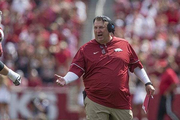 Arkansas coach Bret Bielema congratulates players after a touchdown during a game against TCU on Saturday, Sept. 9, 2017, in Fayetteville. 