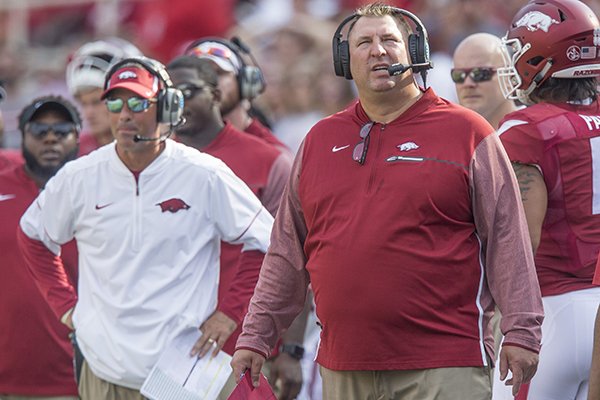 Arkansas coach Bret Bielema (right) and offensive coordinator Dan Enos react during a game against TCU on Saturday, Sept. 9, 2017, in Fayetteville. 