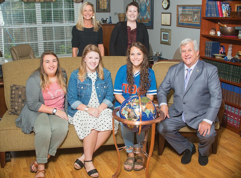 In the front row, from left, students Mercedes Bruce, Kaylan Griffin and Hannah Beck; and back row, Janis Ragsdale and Audra Pleasant, international programs administrators, gather with Jeff Hopper, far right, dean of international programs at Harding University in Searcy. Beck said the Harding in Zambia program expands the students’ worldview while giving them an opportunity to serve others.