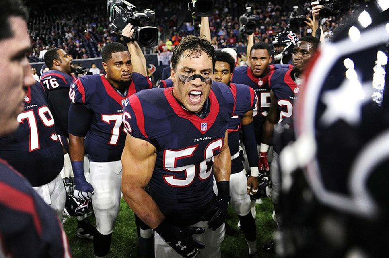In this Saturday, Dec. 24, 2016 file photo, Houston Texans inside linebacker Brian Cushing (56) encourages his teammates before an NFL football game against the Cincinnati Bengals in Houston.