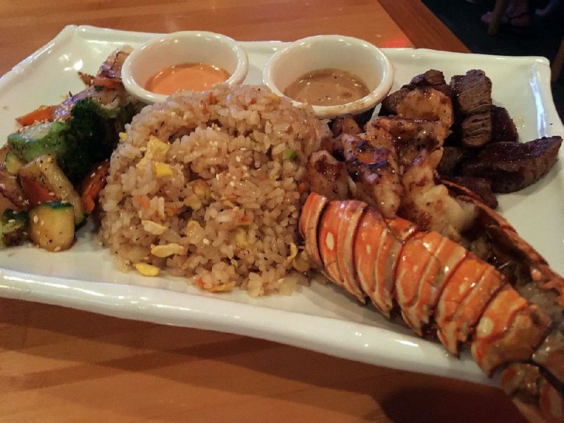 The lobster and filet mignon hibachi entree comes with fried rice and grilled vegetables at Ninja Bar, Sushi & Grill on Cantrell Road. 