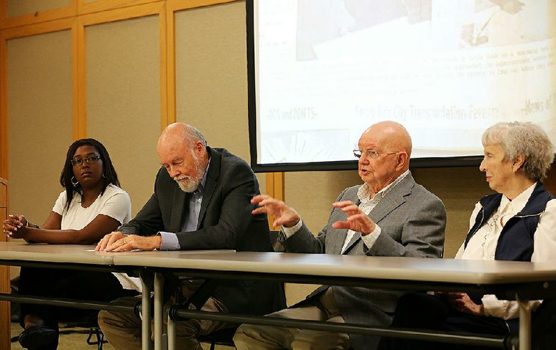 Panelists (from left) Tafi Mukunyadzi, Ernie Dumas, Bill Lewis and Phyllis Brandon discuss coverage of the integration of Central High School in 1957 at the Darragh Center Auditorium in Little Rock on Wednesday night. 