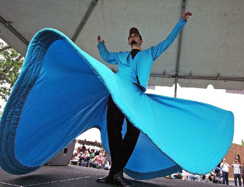 Whirling Dervish Onur Kasaburi performs at last year’s Turkish Food Festival. This year’s festival of food, arts and crafts and performances is planned for Saturday at the Raindrop Turkish House. 