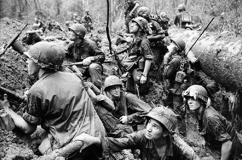 American troops keep a wary eye out for Viet Cong snipers in this 1967 file photo. Ken Burns’ The Vietnam War debuts Sunday on AETN.
