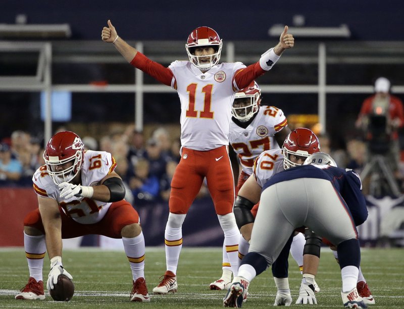 FILE - In this Thursday, Sept. 7, 2017, file photo, Kansas City Chiefs quarterback Alex Smith (11) calls signals at the line of scrimmage during the first half of an NFL football game against the New England Patriots, in Foxborough, Mass. Alex Smith outplayed the Patriots' Tom Brady in their season opener last week, serving notice that he isn't going anywhere as Kansas City's starter.(AP Photo/Steven Senne, File)