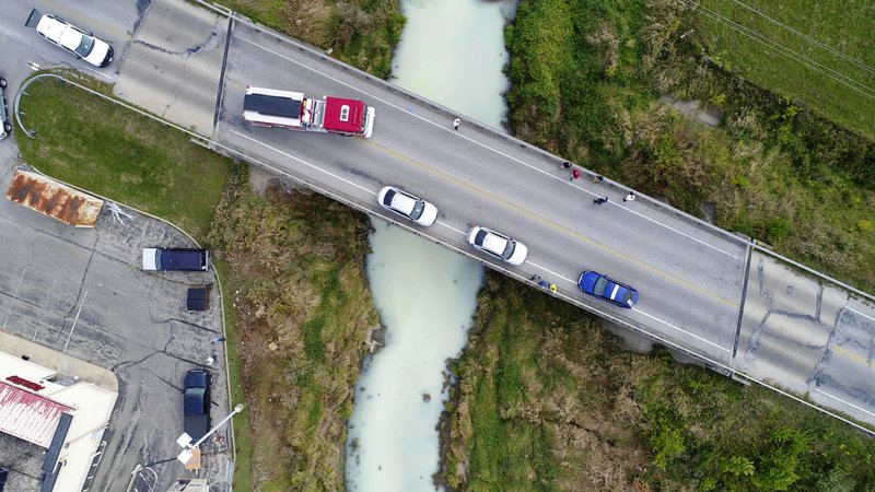 This Sept. 12, 2017, drone photo provided by Tipton County Emergency Management shows an accidental milk spill at a food processing business that ended up turning a central Indiana creek white in Tipton, Ind. 