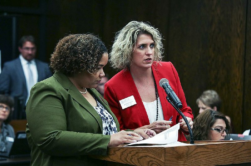 Alexandra Boyd (left), director of public charter schools for the Arkansas Department of Education, and Jennifer Davis, staff attorney for the department, are shown in this file photo.