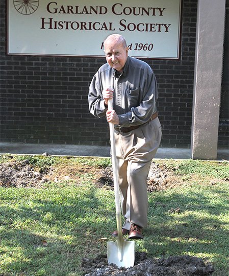 The Sentinel-Record/Richard Rasmussen HISTORICAL DIG: Garland County Historical Society volunteer Orval Allbritton digs the ceremonial first shovel load of dirt Friday during the official groundbreaking for the society&#8217;s expansion of its archives building at 328 Quapaw Ave.